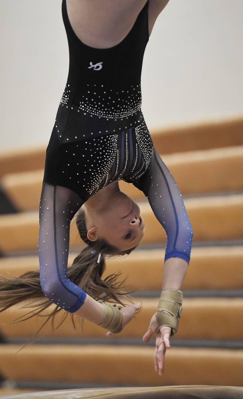 Geneva’s Maeve Devlin performs on the vault at the Geneva girls gymnastics regional meet in Geneva on Wednesday, February 1, 2023.