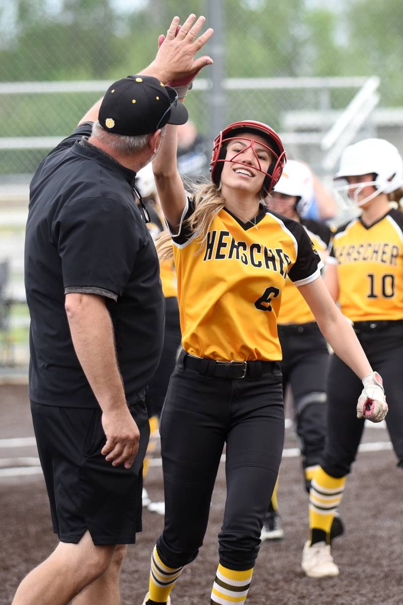 Herscher's Lexi Crawford high fives coach Mike Cann during the Tigers' Class 2A Manteno Regional quarterfinal against Peotone at Herscher Monday, May 18, 2026.