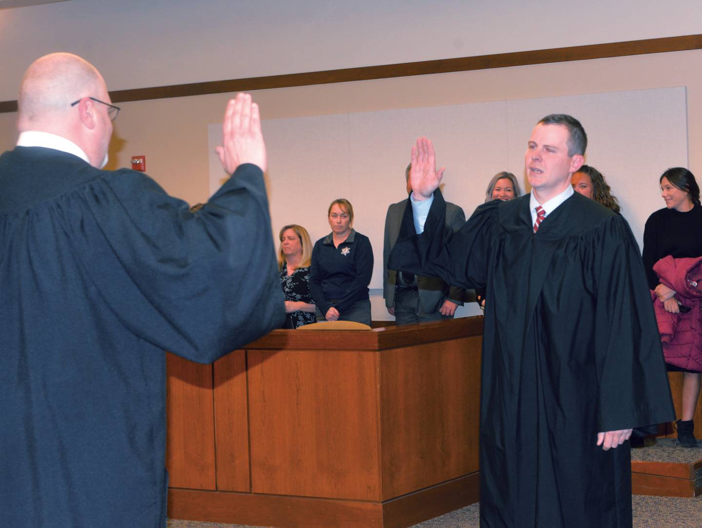 Ogle County Judge John "Ben" Roe (left) swears in Russell Crull as the new associate judge for the 15th Judicial Circuit on Thursday, Nov. 21, 2024 in Courtroom 202 of the Ogle County Judicial Center in Oregon.