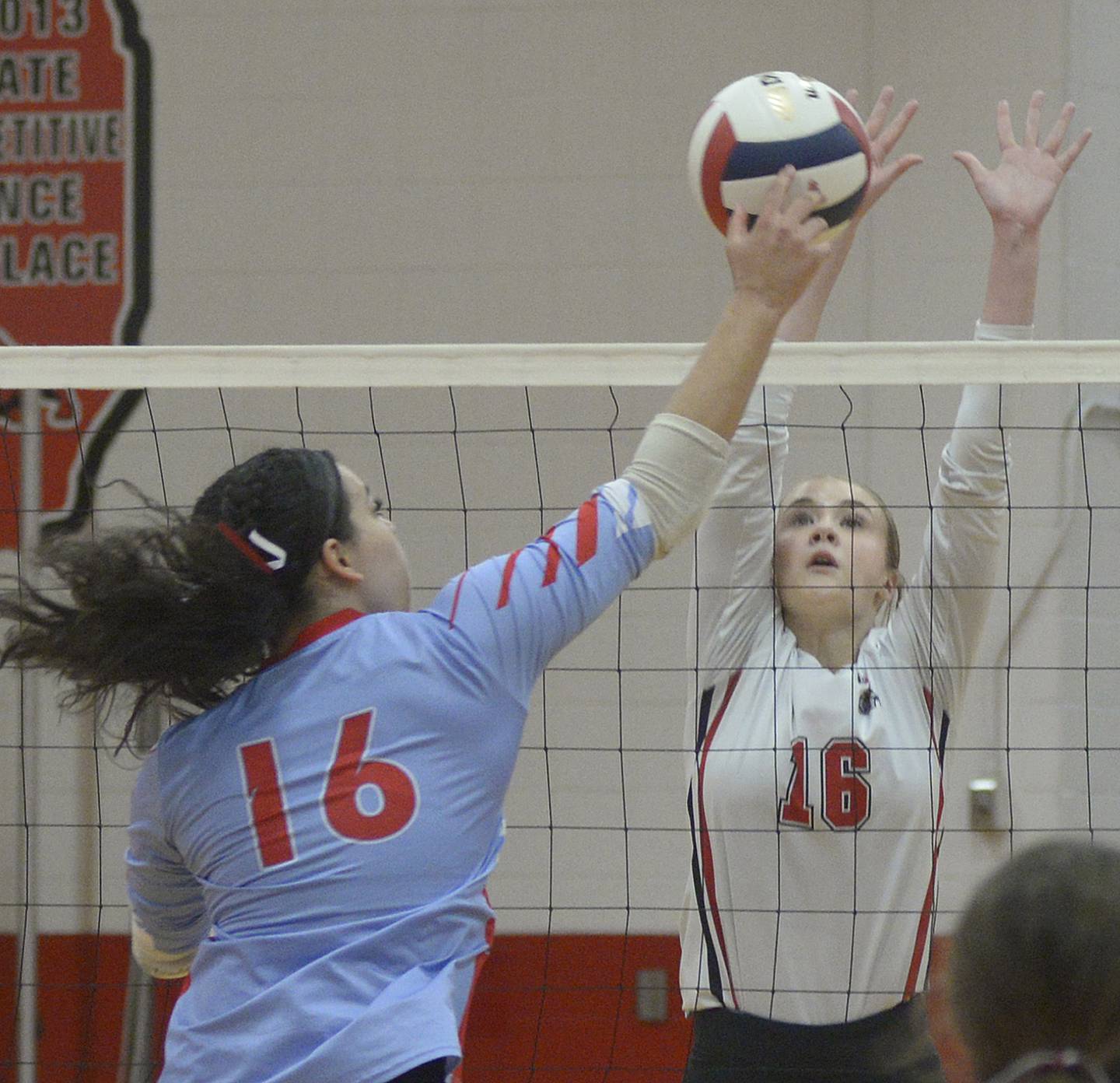 Ottawa’s Chey Joachim works to get the ball past the block of Streator’s Devin Elias  in the second match Thursday at Streator.