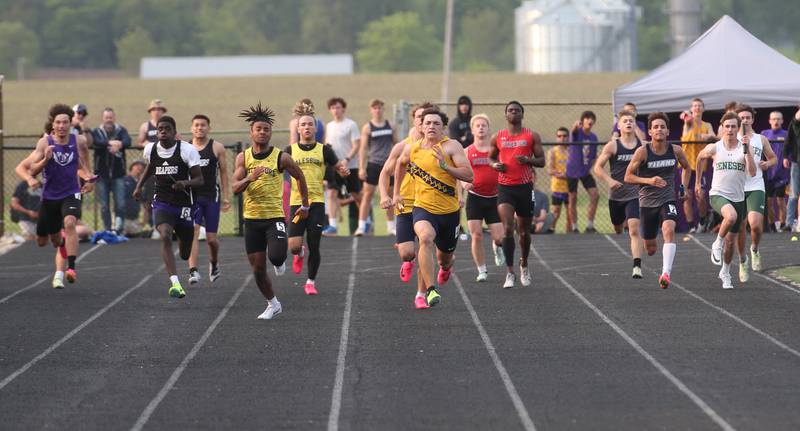 Sterling's Cale Ledergerber (center) leads the pack in the 4x100 meter relay during the Class 2A track sectional meet on Wednesday, May 17, 2023 at Geneseo High School.