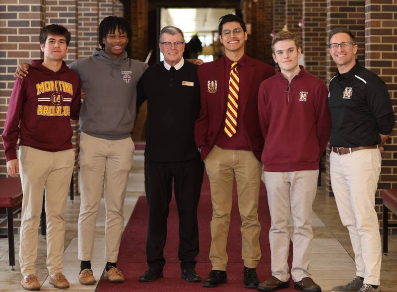 Pictured from left are Montini Catholic seniors Ruben Galvan and Jaylen Howery, Brother Pat Conway, seniors Frank Flores and Zander Montgomery and principal Chris Tiritilli.