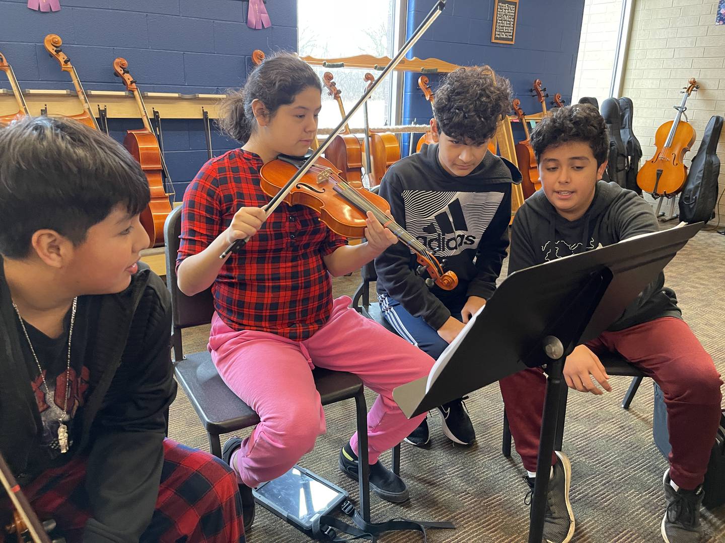 From left to right, Jared Garcia Julio, Mia Najera-Quintero, Eric Ovalle and Chris Cobos Escobar practice music on Friday, Jan. 13, 2023, at Creekside Middle School, as part of the United Sound program. United Sound is geared toward removing social barriers through music. At Creekside, it provides students in special education the opportunity to learn how to play while receiving social interaction.