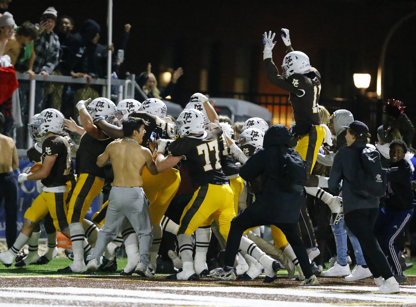 Fans rush the field as Mt. Carmel wins on a last second touchdown during the IHSA Class 7A  varsity football playoff game between Batavia and Mt. Carmel on Friday, November 5, 2021 in Chicago.