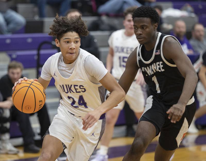 Dixon’s Armahn McGowan drives against Kewanee’s Dayvon Robinson Tuesday, Dec. 2, 2025.