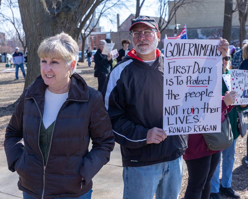 Protester holds sign at the 'Pretti good time for a Protest' on Feb. 15, 2026 at Washington Square Park in Ottawa.