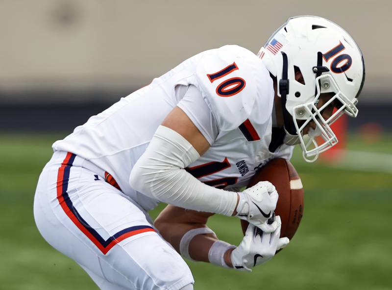 Oswego's Mariano Velasco (10) makes a reception during the varsity football second-round 8A playoff game between Oswego and Lane Tech on Saturday, Nov. 8, 2025 in Chicago.