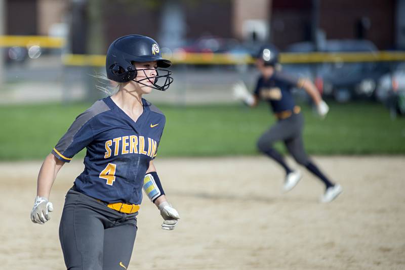 Sterling’s Katie Dittmar heads for third against Geneseo Wednesday, May 4, 2022.