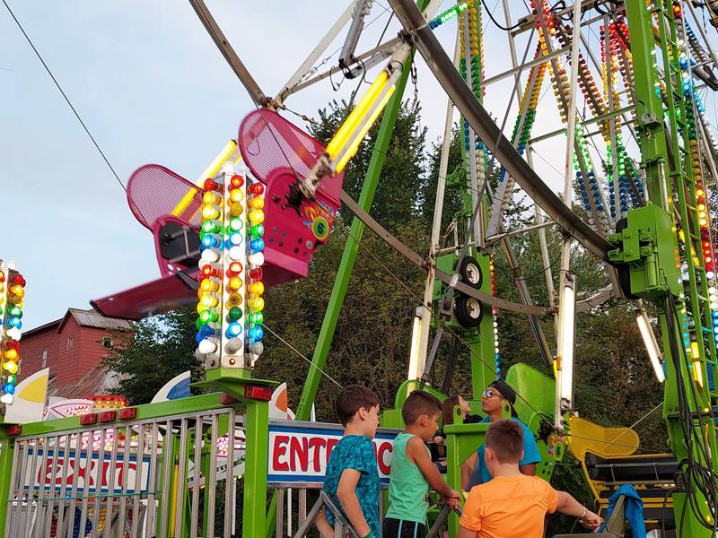 Children wait to get on the Ferris wheel Saturday, Sept. 23, 2023, at Shipyard Days in Seneca.