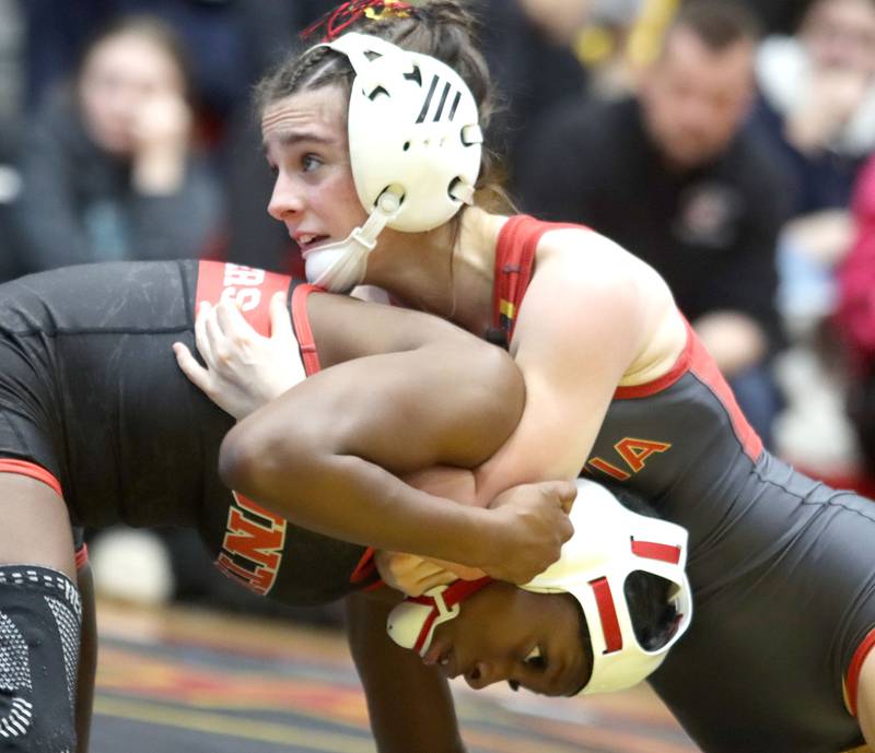 Huntley’s Janiah Slaughter, bottom, battles Batavia’s Lily Enos at 100 pounds in varsity girls IHSA Sectional wrestling on Saturday, February 14, 2026, at Schaumburg High School in Schaumburg.