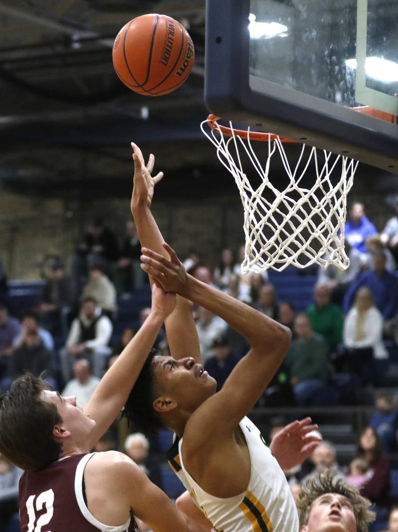 Crystal Lake South's Christian Rohde shoots the ball in front of Wheaton Academy's Ben Dehaan during the IHSA Class 3A Cary-Grove Boys Basketball Regional Championship game on Friday, Feb. 23, 2024 at Cary-Grove High School.