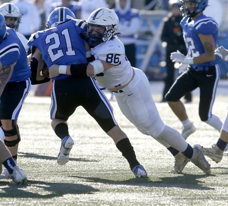 Cary-Grove’s Charles Ciske tackles Lake Zurich's Chris Pirrone during a IHSA Class 6A semifinal playoff football game on Saturday, Nov. 18, 2023, at Lake Zurich High School.