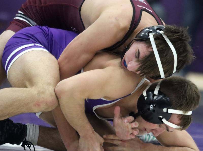 Hampshire’s Austin Savoia, bottom, battles Prairie Ridge’s Ethan Newcomb at 138 pounds in varsity wrestling on Thursday, Dec. 5, 2024 at Hampshire High School in Hampshire.