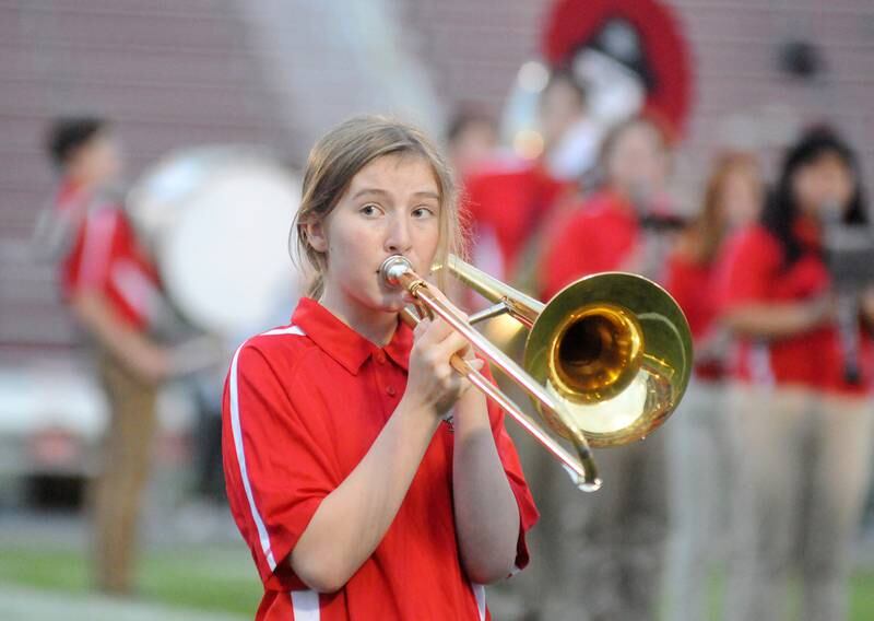 Ottawa sophomore Brielle Grady performs with the marching band before the home football game against Harvard at King Field on Friday, Sept. 8, 2023.