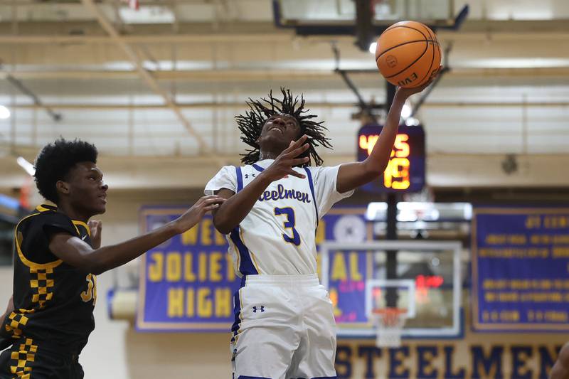 Joliet Central’s Kennedy Edwards lays in a shot against Joliet West on Thursday, Jan. 15, 2026 in Joliet.