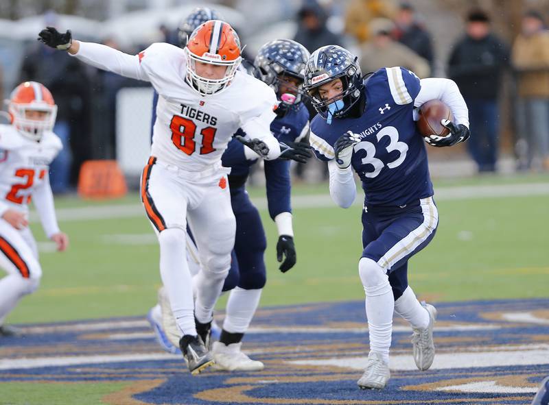 IC Catholic's Joey Gilatta (33) runs the ball during a Class 3A varsity football semi-final playoff game between Byron High School and IC Catholic Prep on Saturday, Nov. 19, 2022 in Elmhurst, IL.