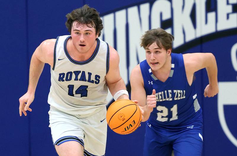 Hinckley-Big Rock's Martin Ledbetter brings the ball up court ahead of Rochelle Zell’s Sam Groth during their game Tuesday, Dec. 17, 2024, at Hinckley-Big Rock High School.