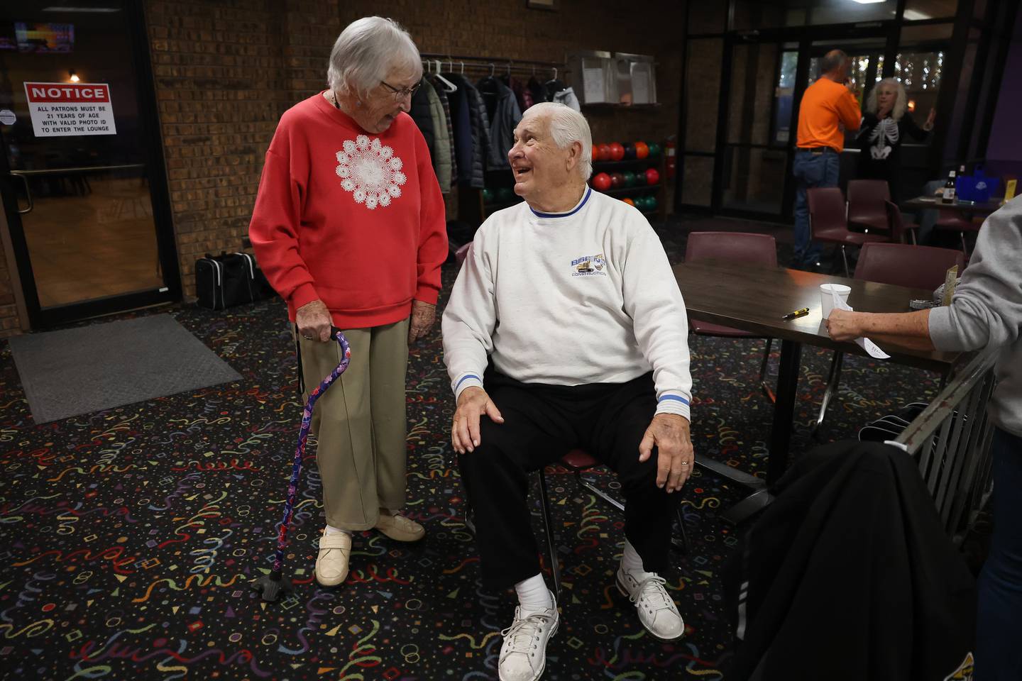 Betty Orlando talks with fellow bowler Tom Bojan, who joined the league in the mid 90’s, at Laraway Lanes on Monday, Oct. 30, 2023 in New Lenox. Betty, who turns a 100 in December, and her late husband Mike started Monday Senior Bowling Night in 1980.