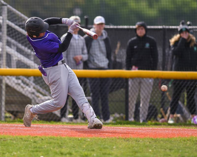 Downers Grove North's JD Cumbee (7) makes contact with the ball during the game on Monday May 19, 2025, while taking on York High School in Elmhurst.