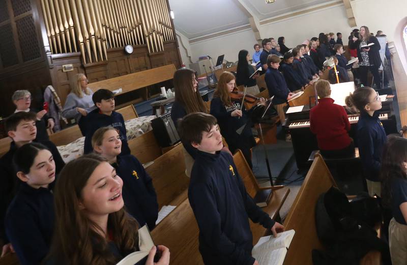 Students from Academy of St. Carlo Acutis, sing in the choir during the very first all-school Mass on Friday, Jan. 30, 2026 at St. Joseph’s Catholic Church in Peru.