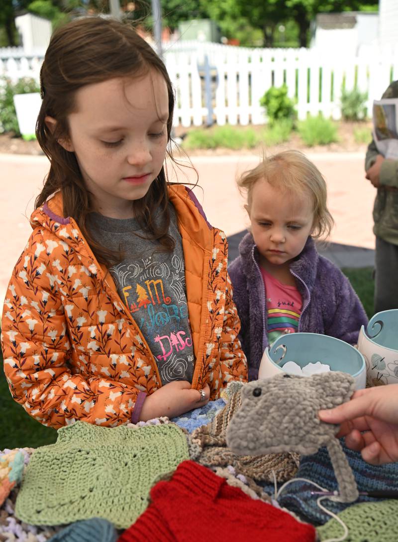 Lyla Johnson, 8, of Yorkville and her sister, Chloe, 4, view fiber arts displayed during 4-H Day at the Naper Settlement on Saturday, May 11, 2024 in Naperville.