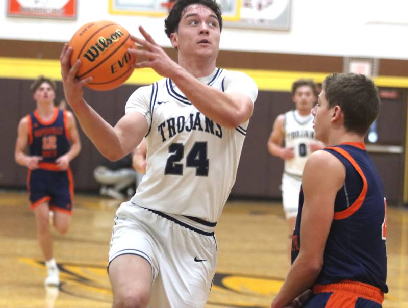 Cary-Grove’s Brady Bauer heads for the hoop against Naperville North in varsity boys basketball Hinkle Holiday Classic action on Monday, Dec. 21, 2025, at Jacobs High School in Algonquin.