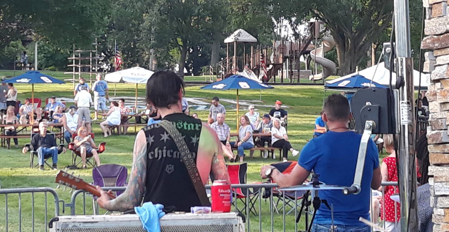 Spectators watch Abbynormal perform Thursday, Aug. 4, 2022, during the opening night of the Taste of the Illinois Valley at Centennial Park in Peru.