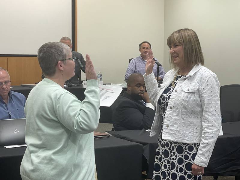 Barb Larson (right) is sworn in May 12, 2025, at the DeKalb City Council meeting.