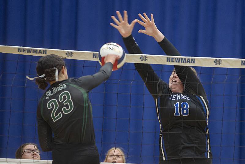 Newman’s Kennedy Rowzee goes up to block a shot by St. Bede’s Ali Bosnich.