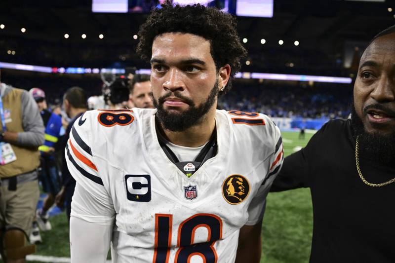 Chicago Bears quarterback Caleb Williams walks off the field after the Bears were defeated by the Detroit Lions 23-20 in an NFL football game in Detroit, Sunday, Nov. 28, 2024. (AP Photo/David Dermer)