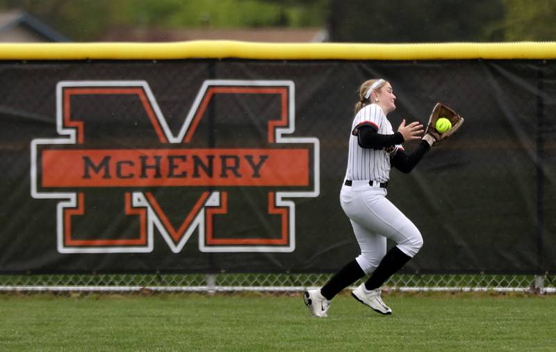McHenry's Lyla Oeffling chases down a fly ball during a Fox Valley Conference softball game against Cary-Grove on Thursday, April 30, 2026, at McHenry High School.