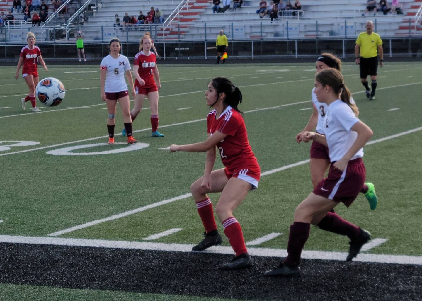 Streator's Addie Lopez (2) looks to control a throw-in in front of Morris defenders Payton Kjellesvik (3) and Joy Dudley (18) during the first half of thr Class 2A regional semifinal Wednesday, May 18, 2022, at Washington High School.