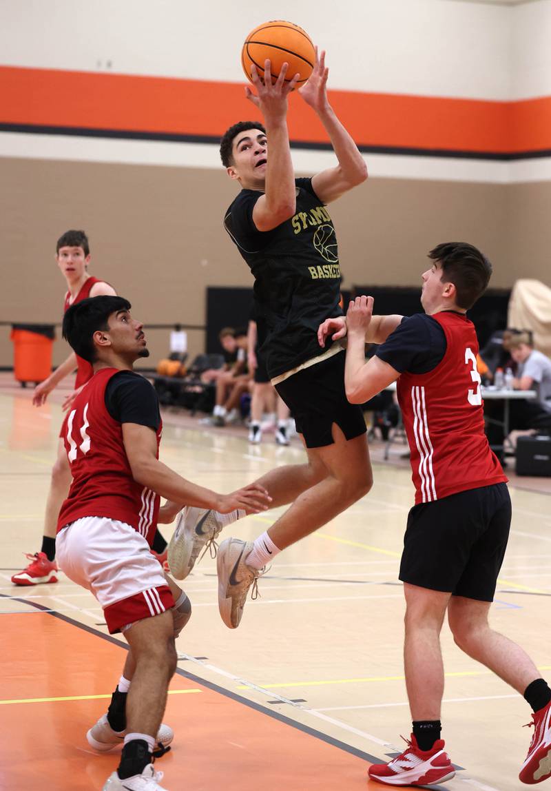 Sycamore’s Marcus Johnson goes to the basket Friday, June 20, 2025, during their game against Marmion in the DeKalb Live summer tournament at DeKalb High School.