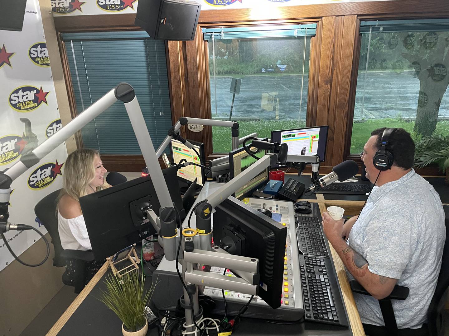 Tina Bree laughs as Joe Cicero jokes about coffee in the Star 105.5 studio on a recent Tuesday morning. The pair are celebrating 15 years as an on-air duo.