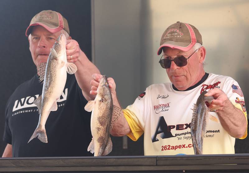 Chris Clemmons of Newark, and Bob Hausler of Plano, hold their fish that they caught during the annual Masters Walleye Circuit tournament on Friday, March 20, 2026 at the Spring Valley Boat Club.