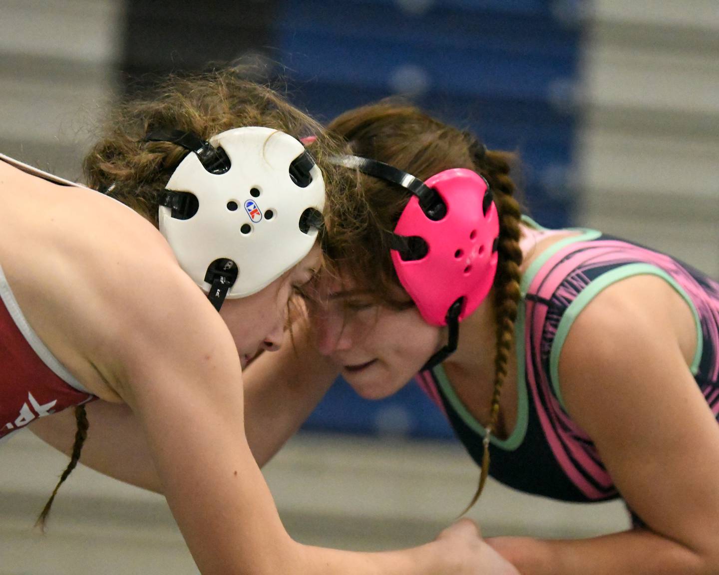 Eva Hermansson of Woodstock, right, keeps her eyes on Veronica Skibicki of Lockport in the 110-weight class championship match on Saturday Jan. 4, 2025, where Eva took second place with \4-3 decision during the Aaron Dundley invite held at Oswego East High School.