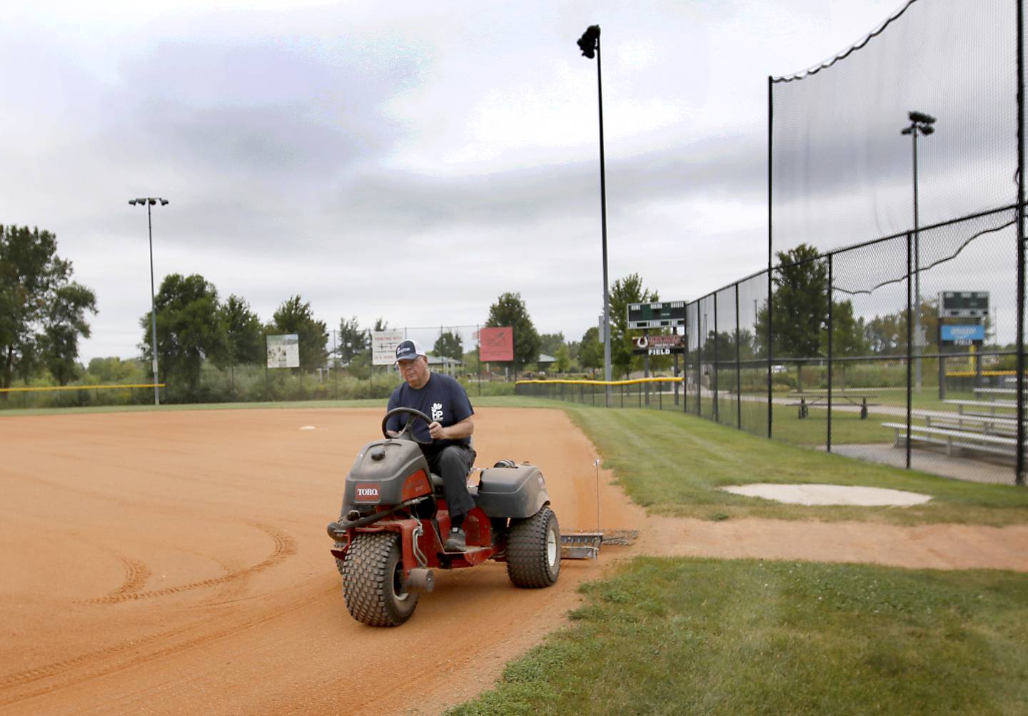 Bob Supernaw prepares a baseball field for a game on Thursday, Aug. 29, 2024, at Tomaso Ball Fields in Huntley. The Huntley Park District is asking residents to approve a $18 million bond referendum on the November 5, 2024, general election ballot to improve, equip and maintain the parks and facilities.