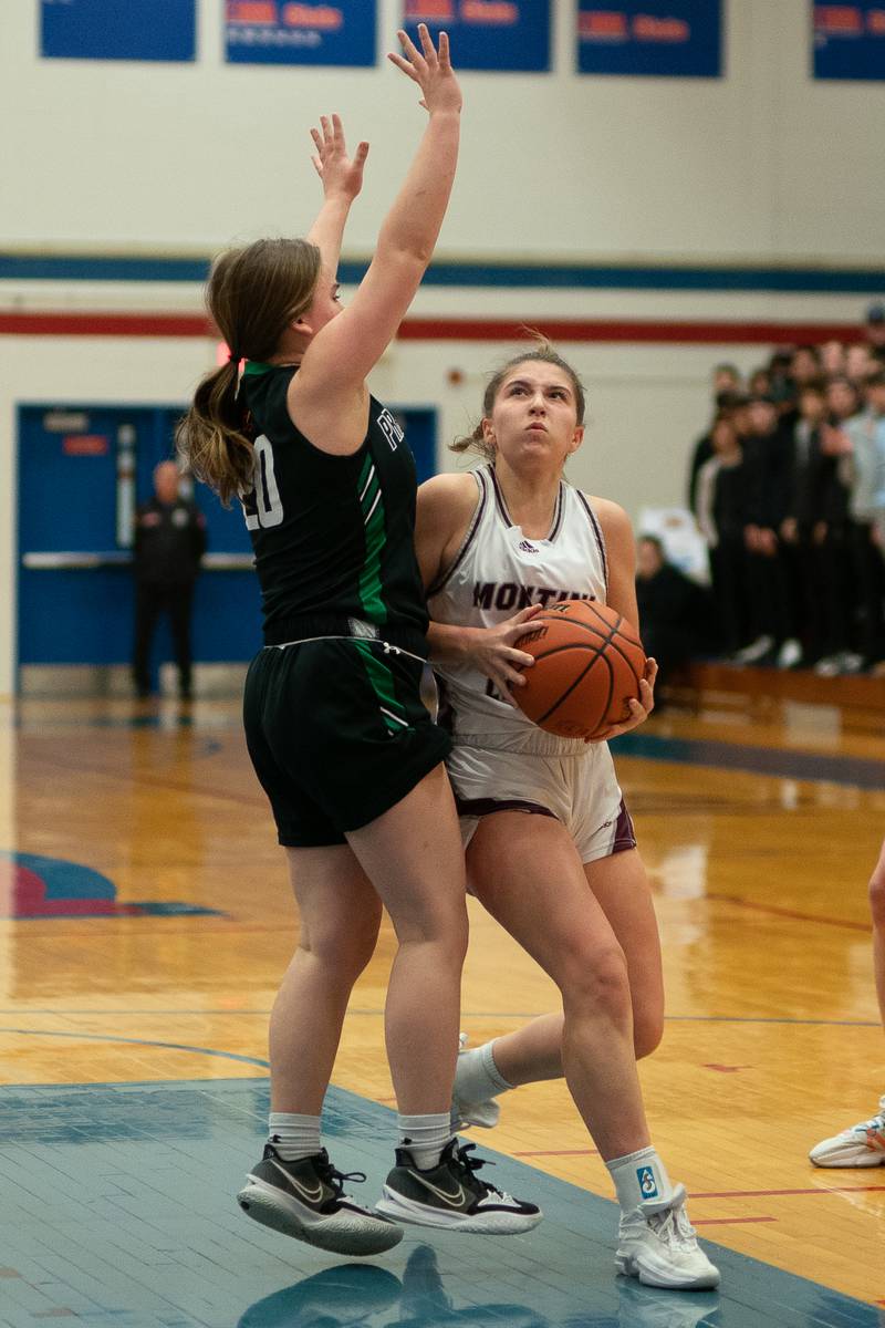 Montini’s Lily Spanos (34) plays the ball in the post against Providence's Gabi Bednar (20) during the 3A Glenbard South Sectional basketball final at Glenbard South High School in Glen Ellyn on Thursday, Feb 23, 2023.