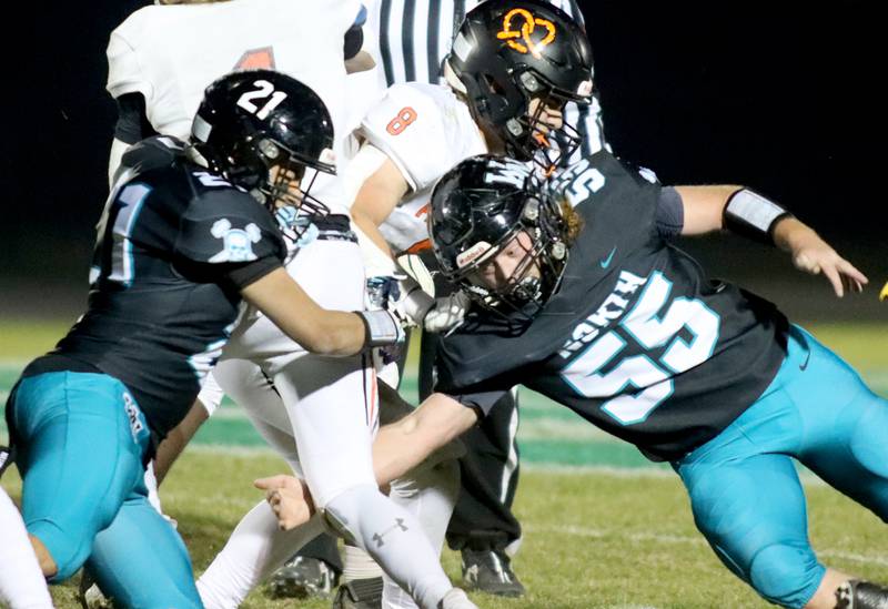 Woodstock North’s Dillon Gavers, right, and Jaden Pena tackle a Freeport ballcarrier in first-round IHSA Playoff football action on Saturday, Nov. 2, 2024 at Woodstock North High School in Woodstock.