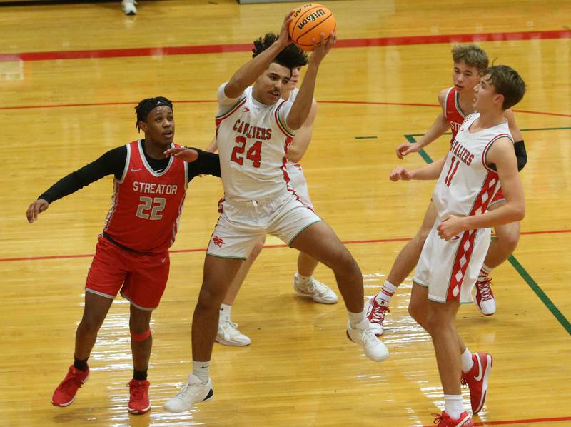 L-P's Marion Persich grabs a rebound over Streator's Tristan Finley on Tuesday, Jan. 14, 2025 in Sellett Gymnasium at L-P High School.