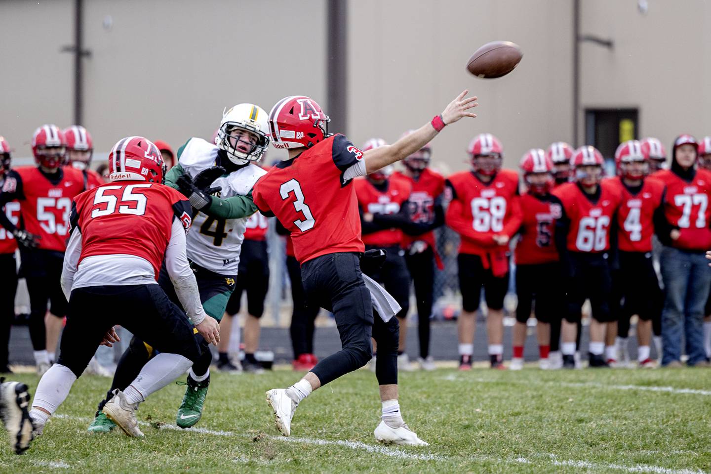 Amboy’s Tucker Lindenmeyer fires a pass downfield for a score Saturday, Nov. 12, 2022 against St. Thomas More during the 8-man semifinals.