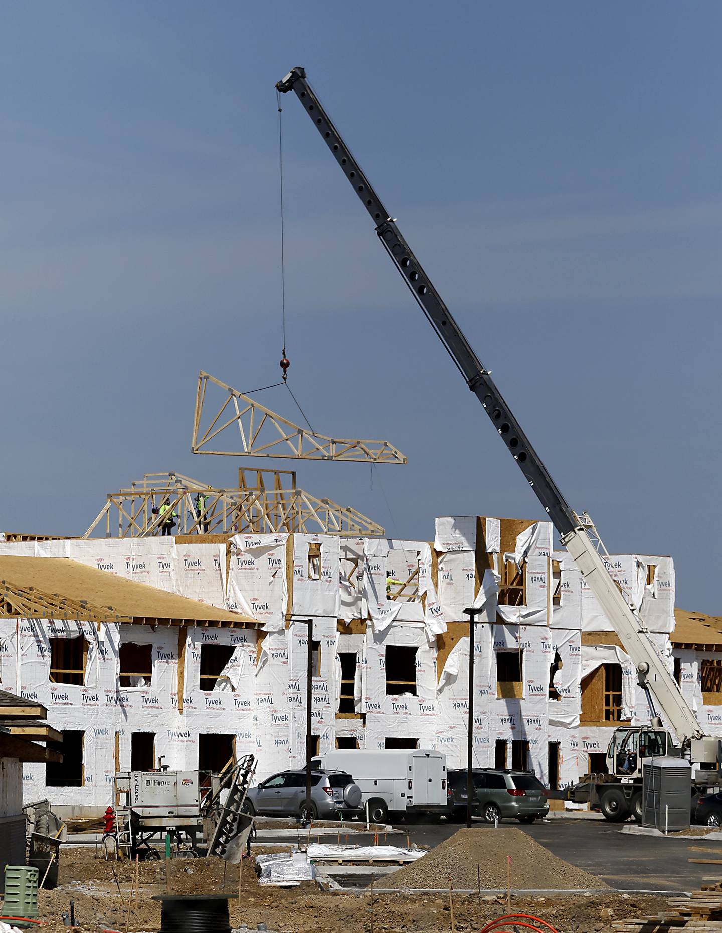 Work continues on Thursday, Sept. 19, 2024, on the mixed-use redevelopment, called Water’s Edge, that will eventually include more than 40,000 square feet of retail and restaurant spaces, open public areas and 260 units of housing at the former long-struggling Crystal Court shopping center in Crystal Lake.
