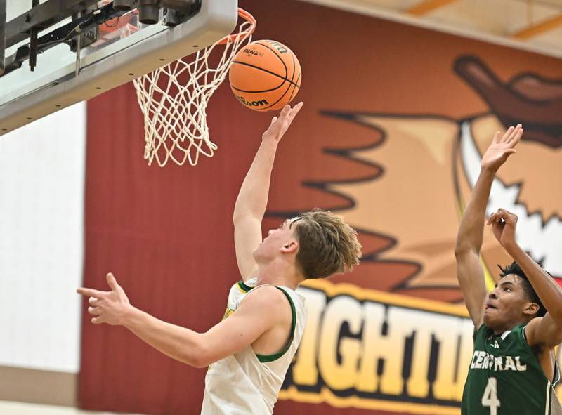 Providence Catholic's Eli Phillips (5) makes a layup during the WJOL tournament game against Plainfield Central on Friday, NOV. 28, 2025, at Joliet.