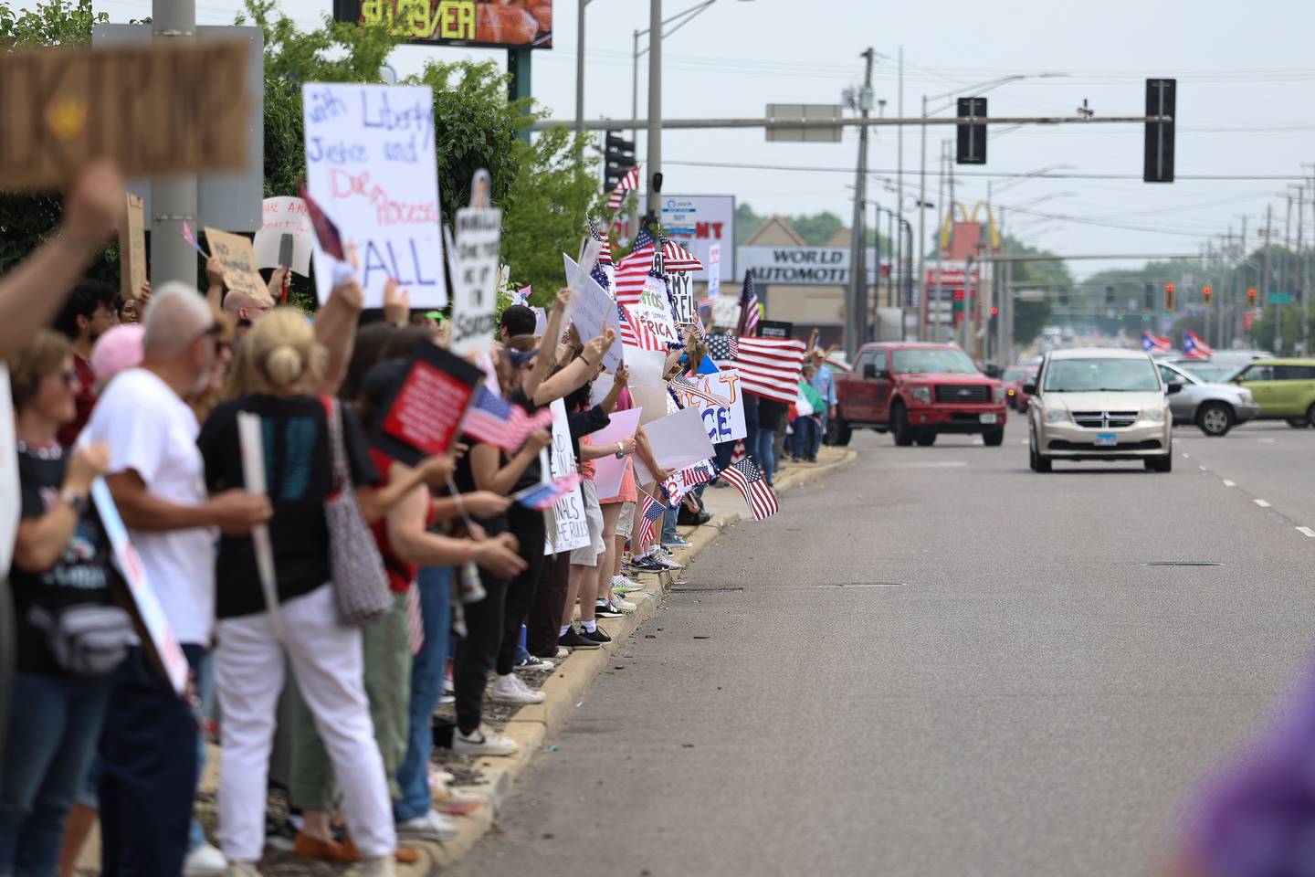 Protesters line West Jefferson Street for the No Kings Day protest on Saturday, June 14, 2025 in Joliet. The rally was attended by an estimated 600 people, according to organizers.