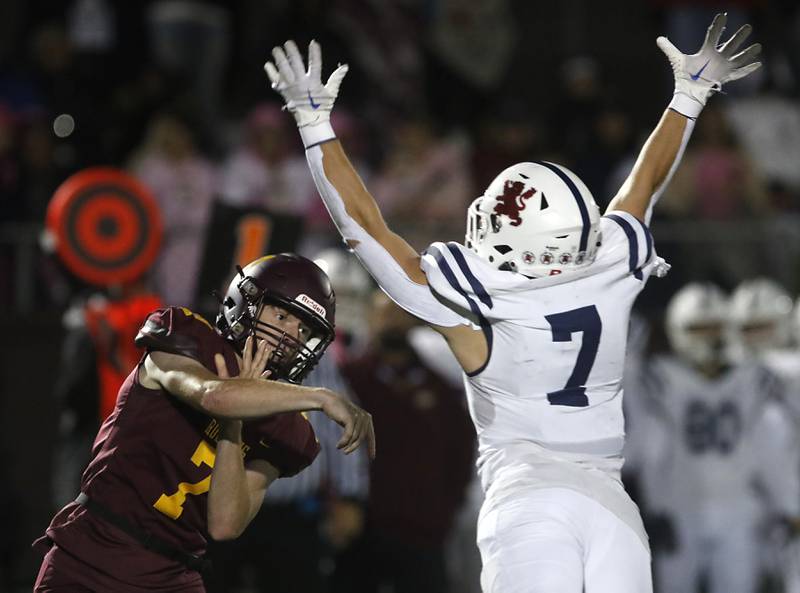 Richmond-Burton's JT Groh keeps his eyes on his pass as St. Viator's Michael Tauscher flies towards him during a IHSA Class 4A first round playoff football game Friday, Oct. 27, 2023, at Richmond-Burton High School in Richmond.