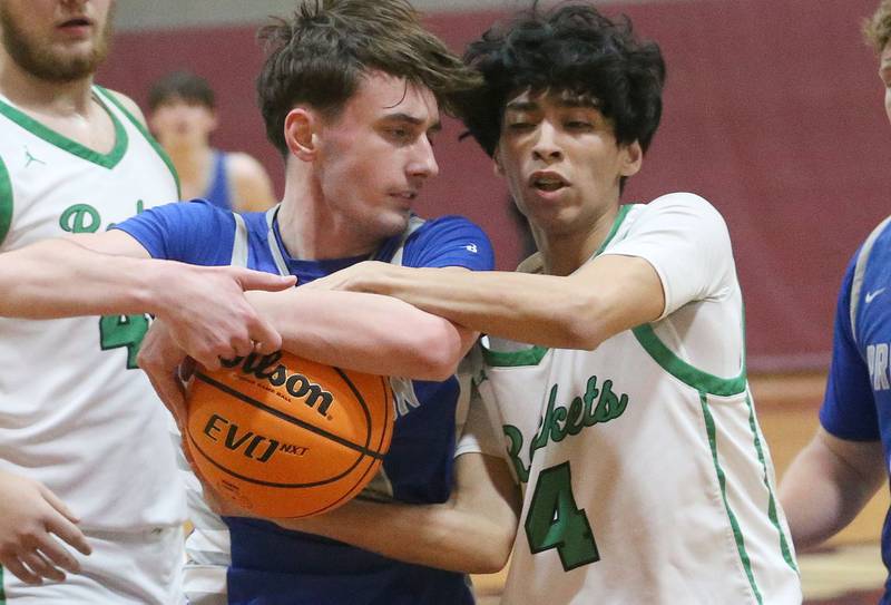 Rock Falls's Christian Hernandez forces a jump ball with Princeton's Gavin Lanham during the Class 2A Sectional final on Friday, March 7, 2025 at Marengo High School.