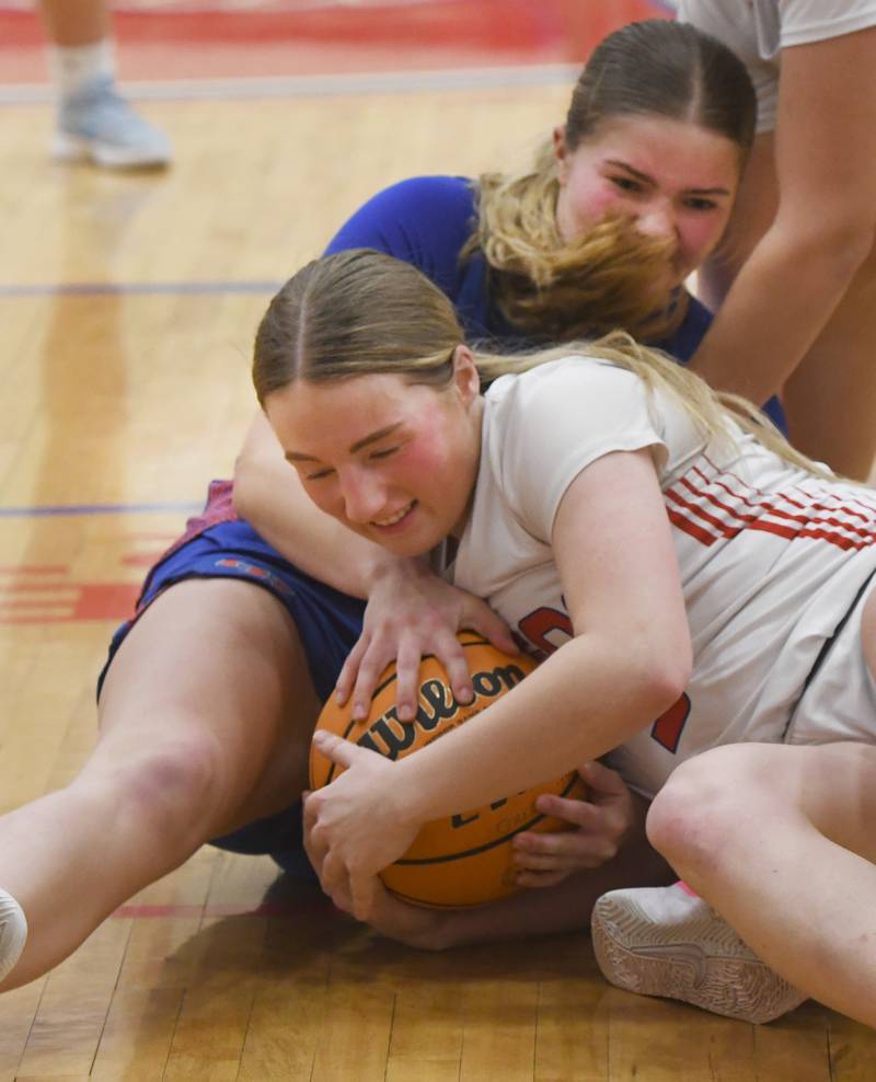 Oregon's Shaylee Davis battles Genoa-Kingston's Arielle Rich for a loose ball on Friday, Jan. 30, 2026 at the Blackhawk Center.