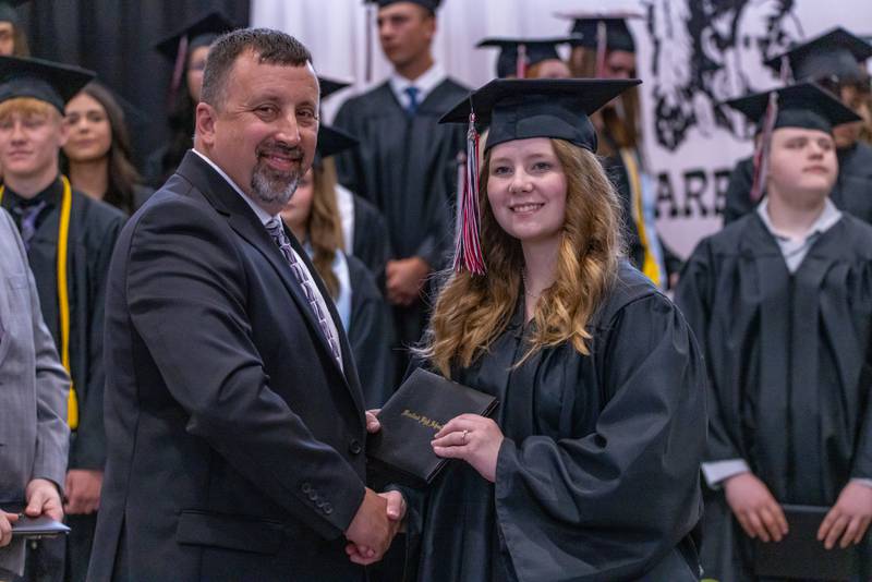 Aubrey DeMoss is presented with her diploma at the Woodland High School Class of 2025 commencement ceremony on Sunday, May 18, 2025 at Woodfield High School.