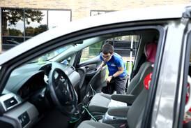 Geneva High School students develop work-based skills at car wash