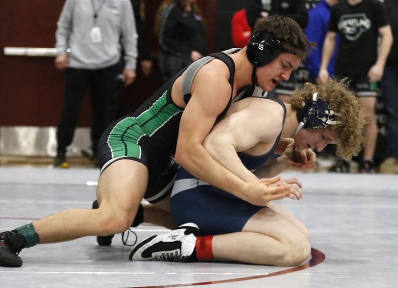 Cary-Grove’s Noah Pechotta tries to escape the grasp of Grayslake Central’s William Lyle in a 165-pound semifinal match of theIHSA 2A Antioch Wrestling Regional on Saturday, Feb. 8, 2025, at Antioch High School.